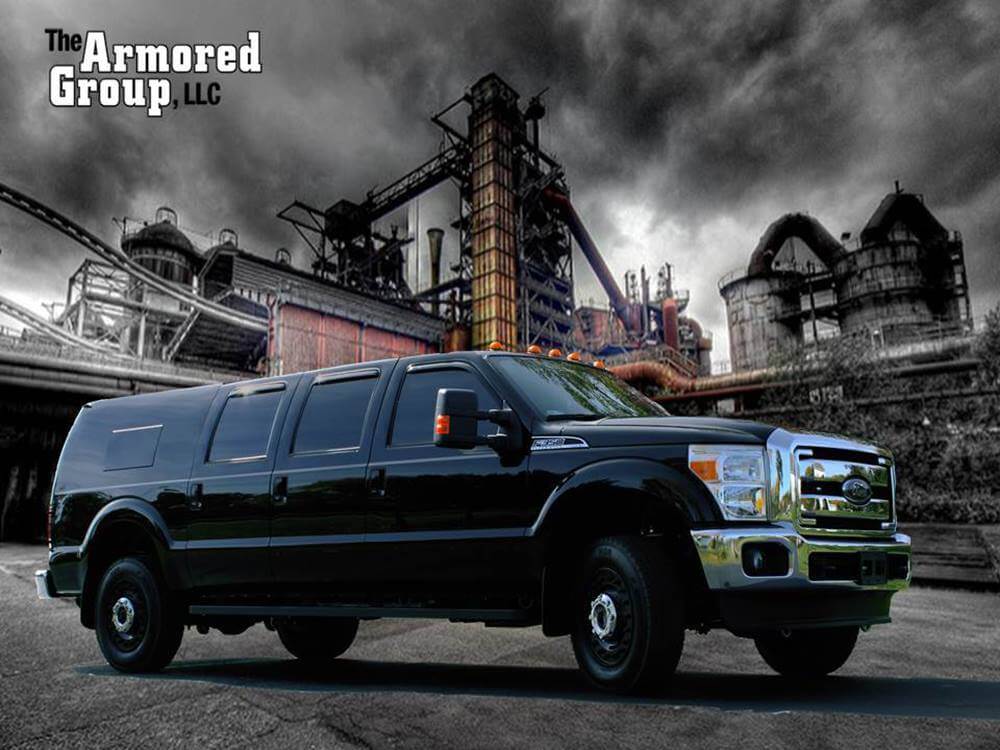 TAG Super Duty Ford SUV - Dec 2016 Outside Factory View Logo